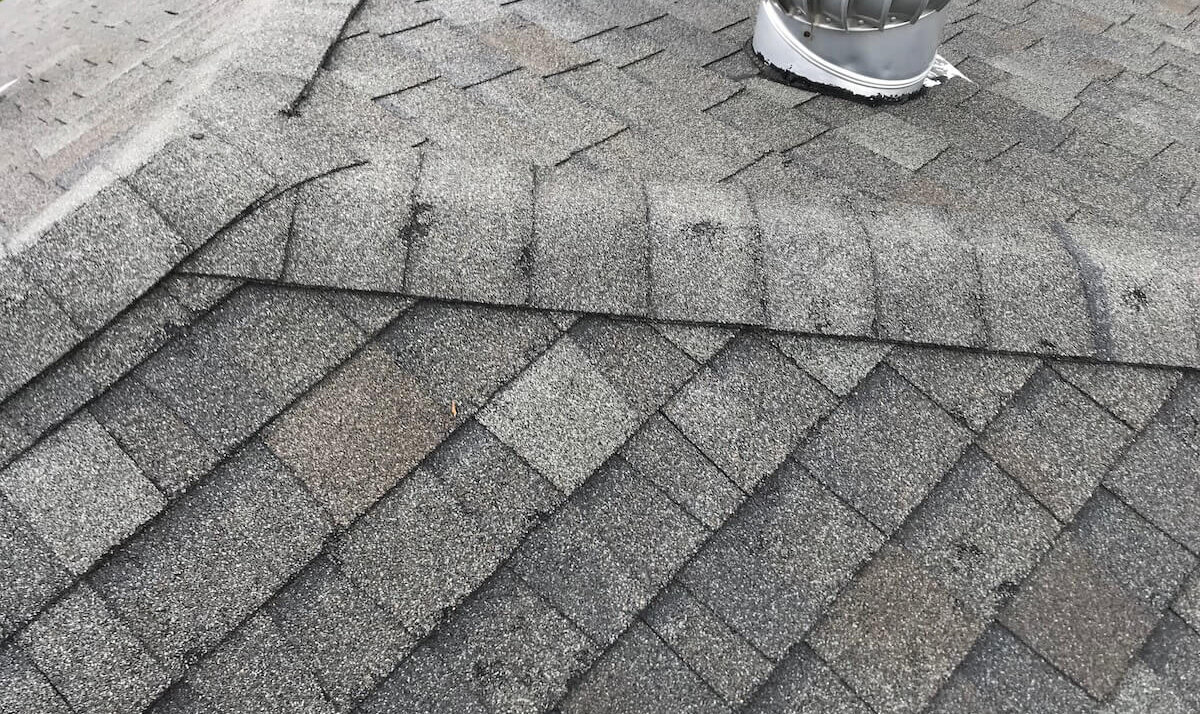 Hail-damaged asphalt shingles Hail-damaged asphalt shingles