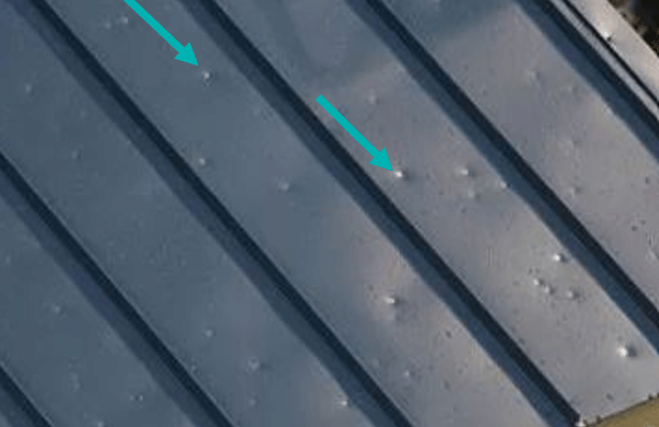 Figure 5_Hail-damaged metal roofing Hail-damaged metal roofing